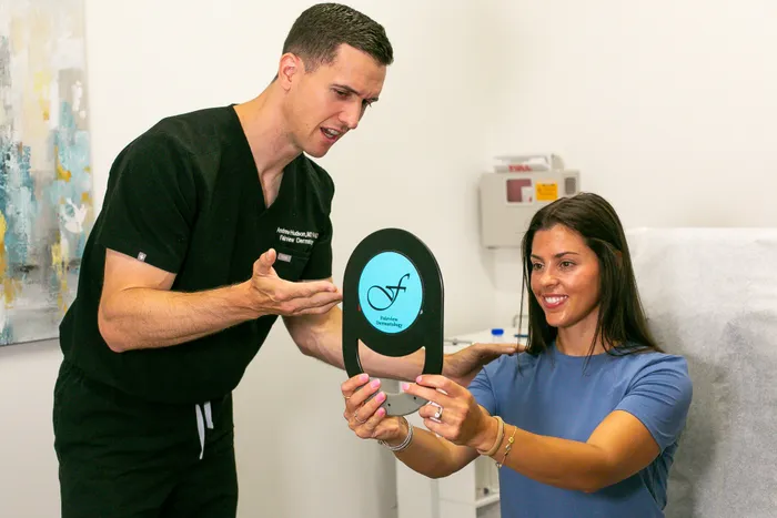 Dr. Hudson Standing In Front of Practice